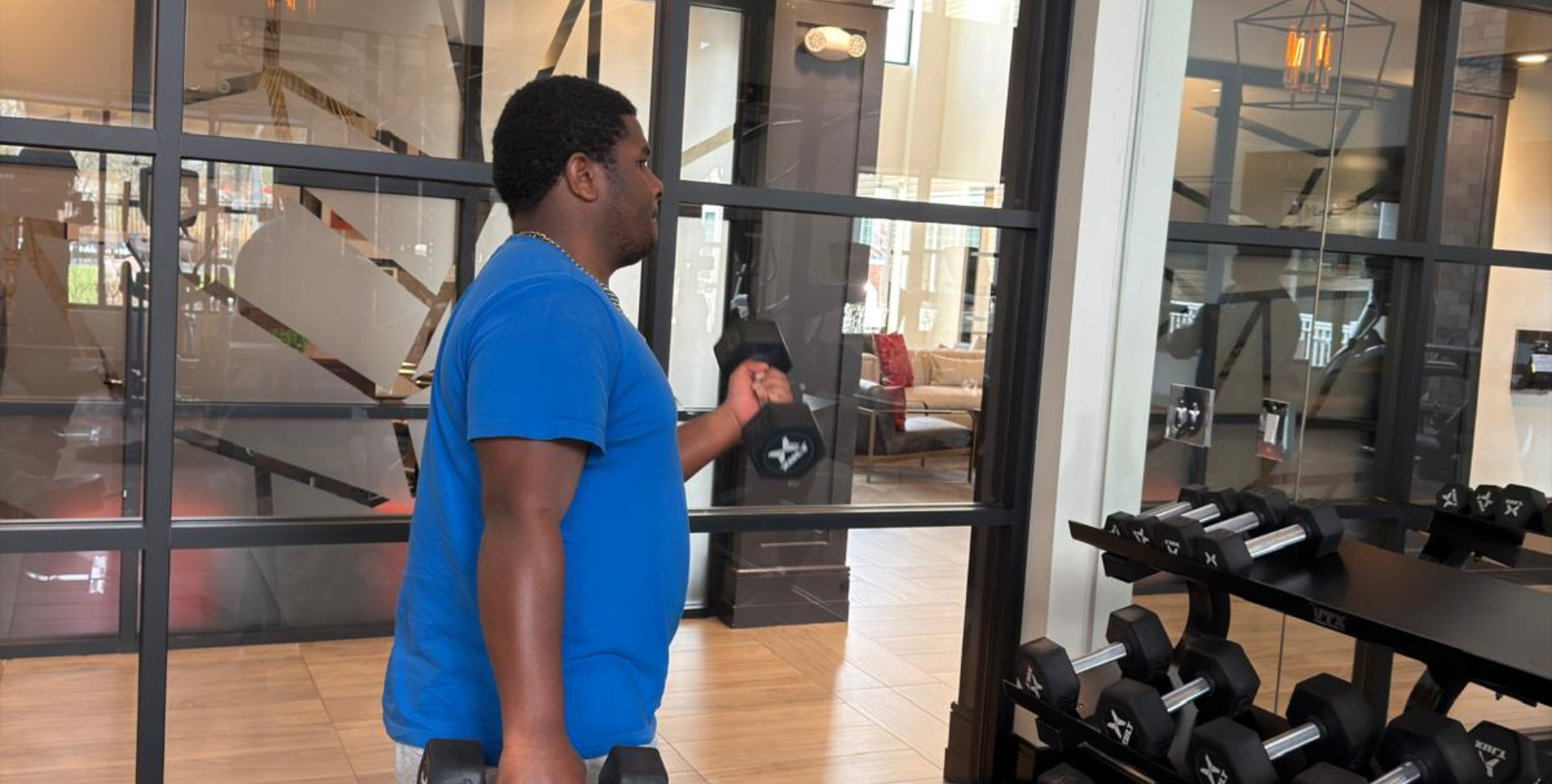 Man lifts dumbbells
