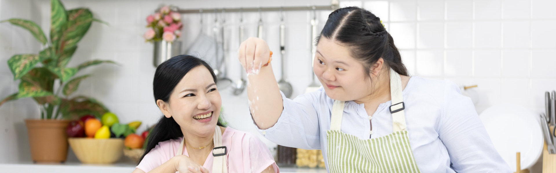 woman helping lady cook
